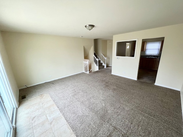 tiled empty room with sink