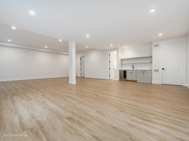 basement featuring light hardwood / wood-style floors