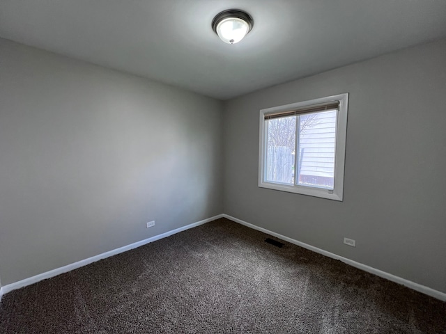 unfurnished room with carpet floors