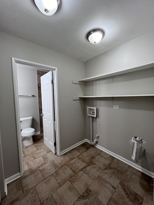 laundry area featuring gas dryer hookup, tile floors, and washer hookup