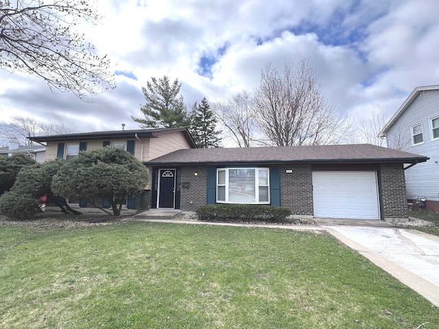 tri-level home with a garage and a front yard