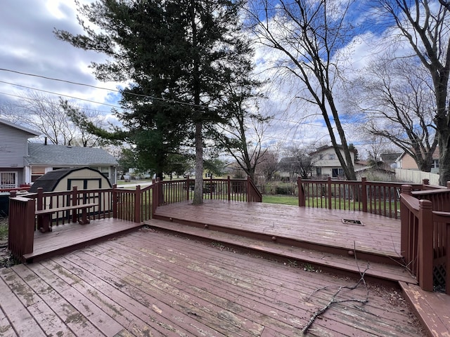 wooden terrace with an outdoor structure