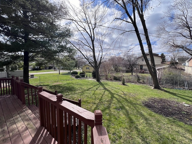 wooden terrace with a yard