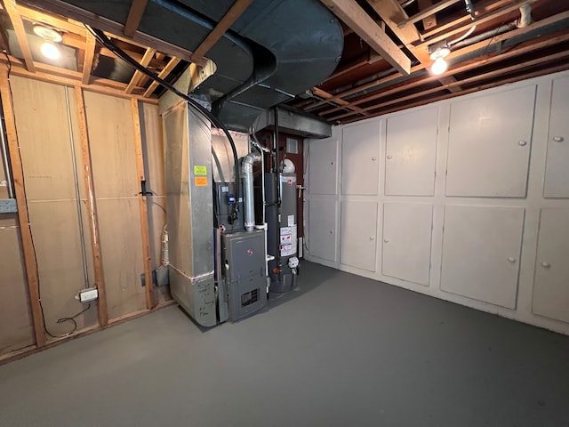 basement with heating utilities and water heater