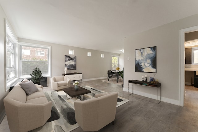 kitchen featuring light wood-style floors, a wealth of natural light, light countertops, and a sink