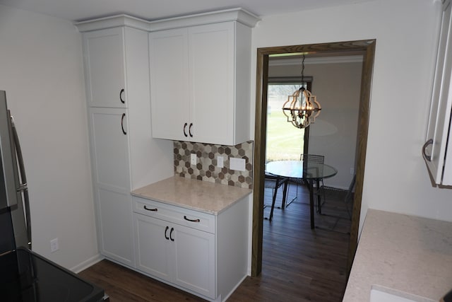 kitchen with backsplash, dark wood-type flooring, and white cabinetry