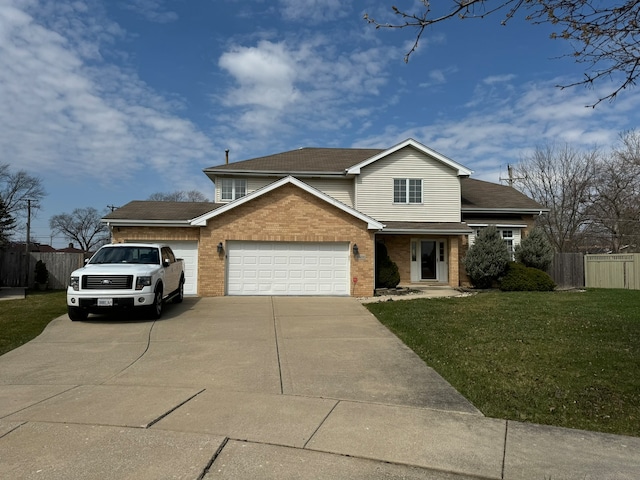 view of front facade with a garage and a front yard