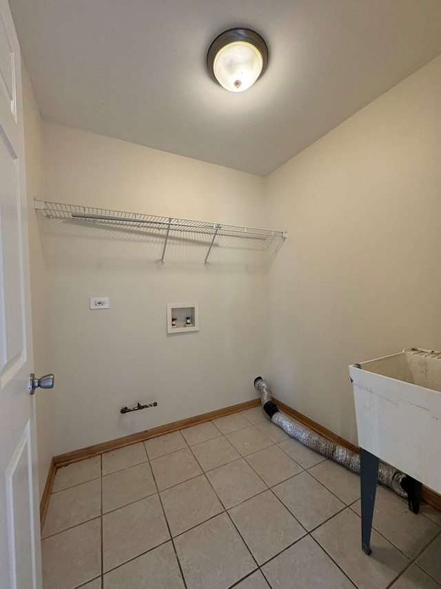 laundry area featuring washer hookup, gas dryer hookup, and light tile floors