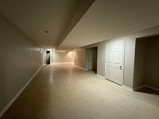 basement featuring light tile flooring