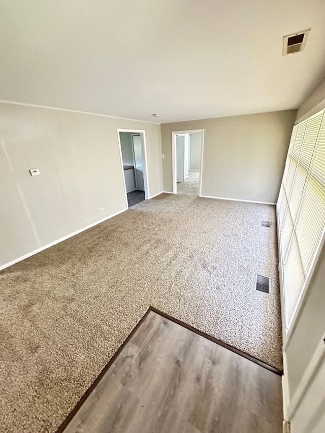 empty room featuring wood-type flooring