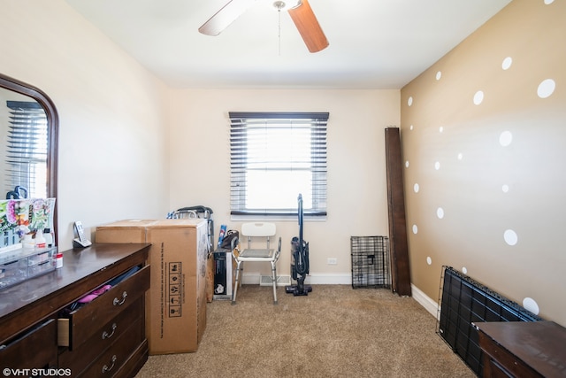 home office with ceiling fan and light carpet