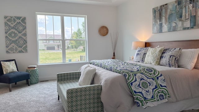 carpeted bedroom with baseboards and visible vents