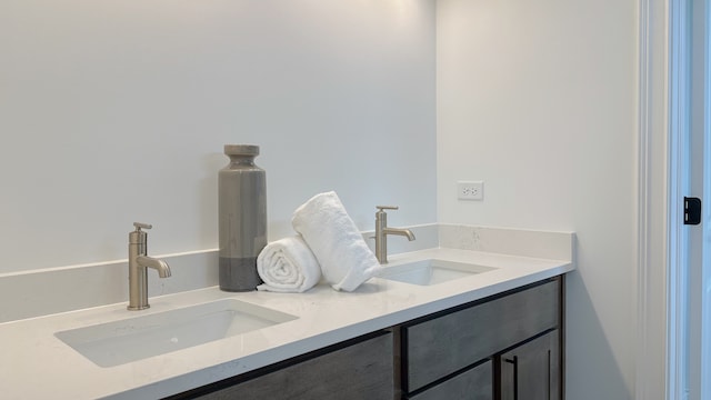 bathroom with double vanity and a sink