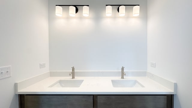 bathroom featuring double vanity and a sink