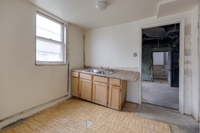 kitchen with sink and light parquet floors