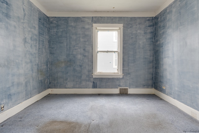 empty room featuring carpet flooring