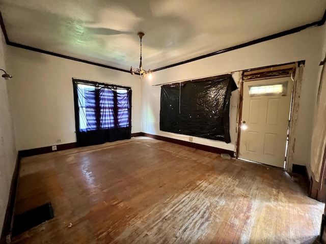 657 W Wood St, Decatur, IL 62522 - empty room with ornamental molding, hardwood / wood-style flooring, and baseboards