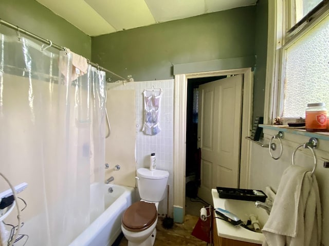 657 W Wood St, Decatur, IL 62522 - full bath with toilet, shower / bathtub combination with curtain, tile walls, and vanity