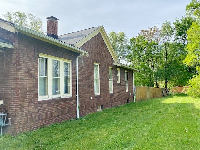 view of home's exterior featuring a lawn