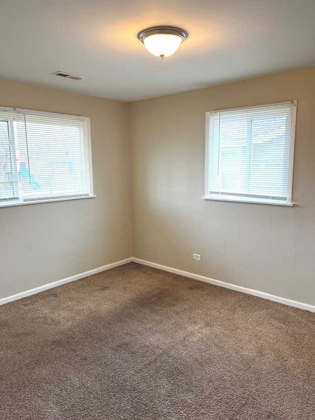 view of carpeted spare room