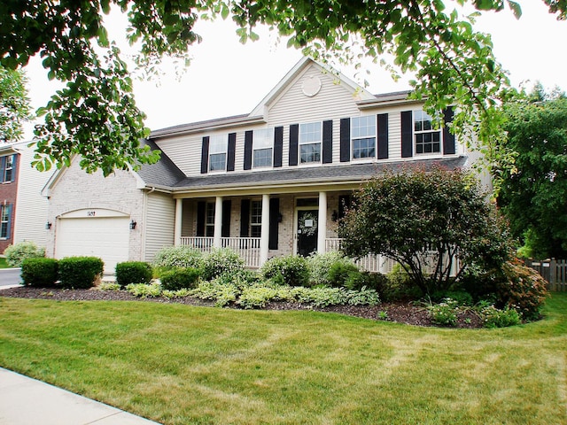 view of front of home featuring a front lawn and covered porch