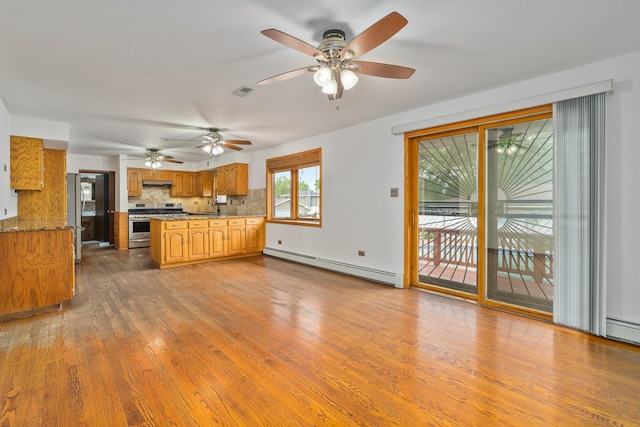 6840 157th St, Tinley Park, IL 60477 - kitchen featuring a baseboard radiator, stainless steel appliances, dark wood-style flooring, range hood, and backsplash