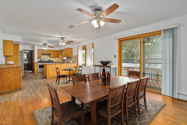 6840 157th St, Tinley Park, IL 60477 - dining area featuring a ceiling fan and light wood-type flooring