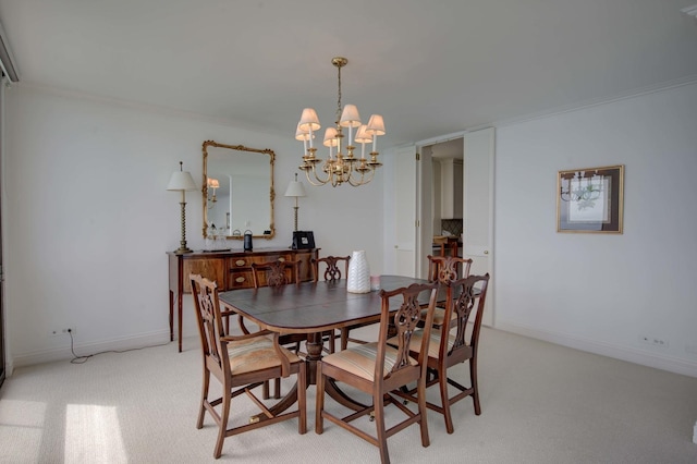 dining space with ornamental molding, light colored carpet, and an inviting chandelier