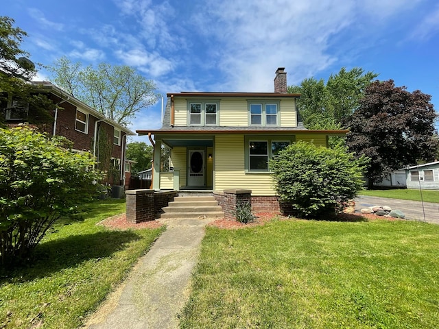 view of front of property featuring covered porch and a front yard