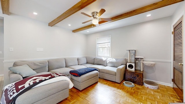 living room featuring beamed ceiling, ceiling fan, and light parquet flooring