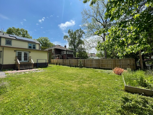 view of yard featuring french doors