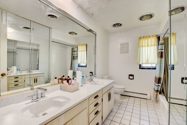 full bathroom with toilet, tile patterned flooring, dual bowl vanity, a baseboard heating unit, and shower / tub combo with curtain