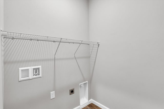 laundry room featuring electric dryer hookup, hookup for a washing machine, and hardwood / wood-style floors