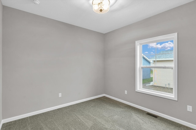 empty room featuring carpet floors