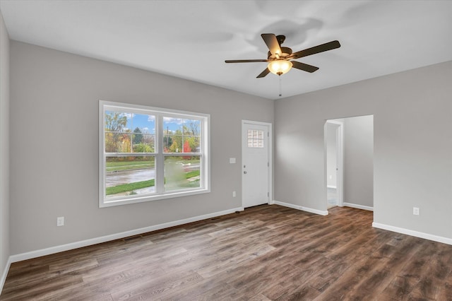 empty room featuring dark hardwood / wood-style floors and ceiling fan