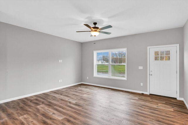 unfurnished room featuring dark hardwood / wood-style flooring and ceiling fan