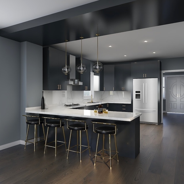 kitchen with white fridge with ice dispenser, kitchen peninsula, pendant lighting, and dark wood-type flooring