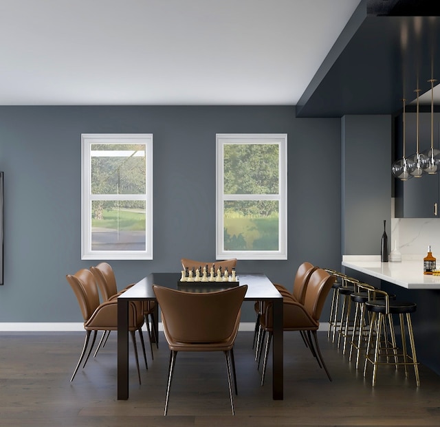 dining space with plenty of natural light and dark wood-type flooring