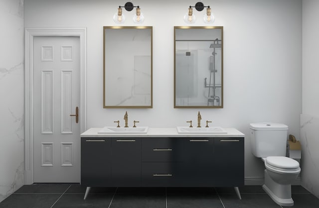 bathroom with double vanity, tile floors, and toilet