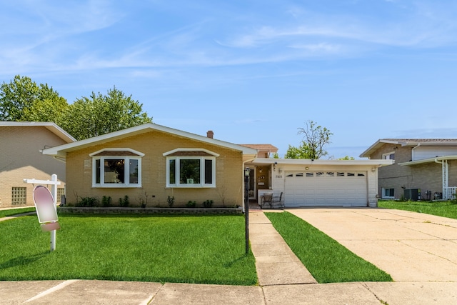 ranch-style home featuring a garage and a front yard