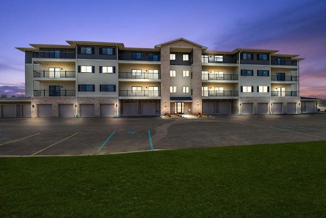 view of outdoor building at dusk