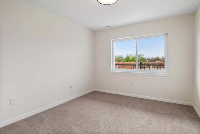 view of carpeted spare room