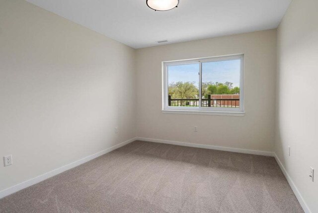 unfurnished room featuring carpet floors