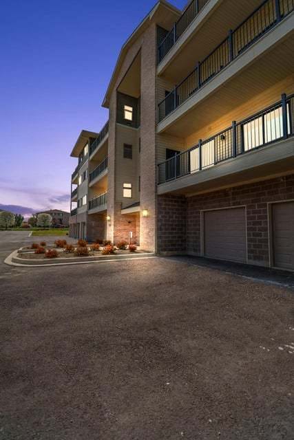 outdoor building at dusk featuring a garage