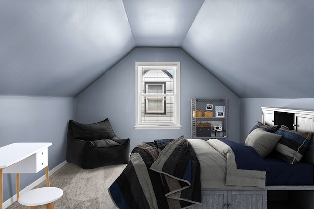 bedroom featuring carpet floors and lofted ceiling