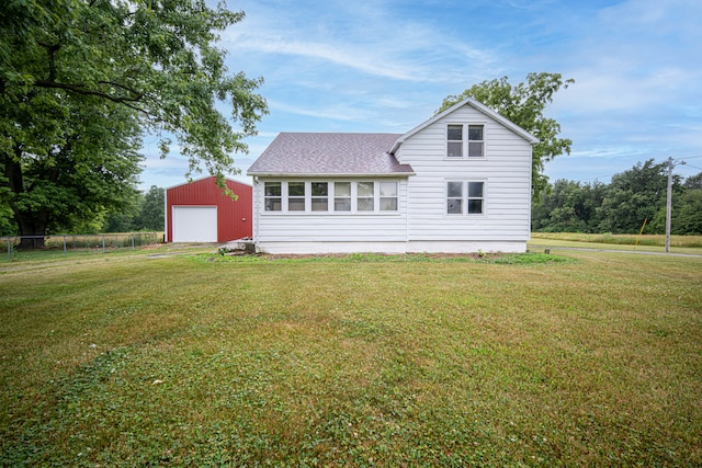 rear view of property with a lawn