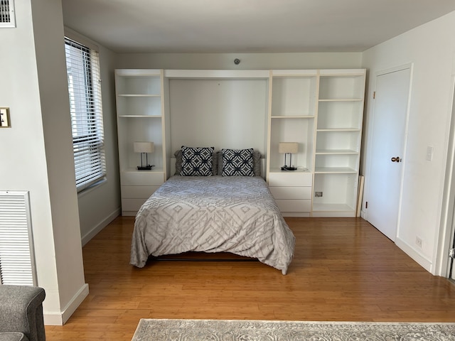 bedroom featuring wood-type flooring