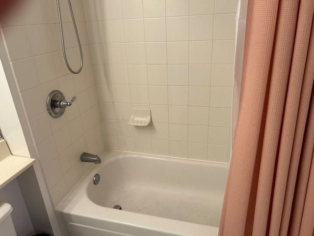 bathroom with shower / tub combo with curtain