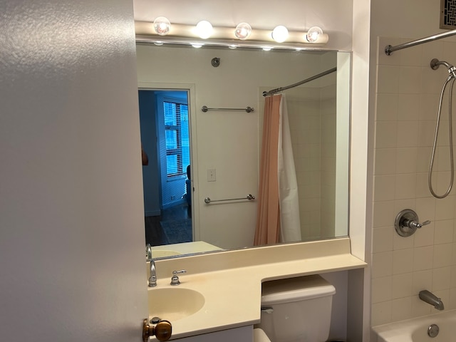 full bathroom featuring vanity, toilet, and shower / bath combo