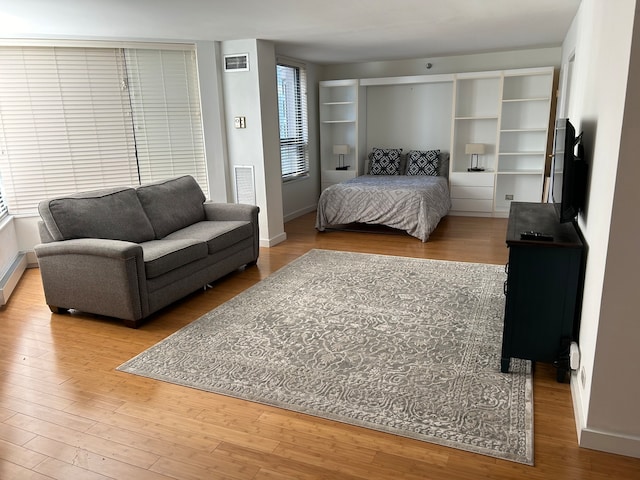 bedroom with hardwood / wood-style floors